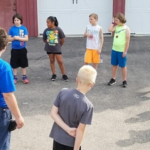 Kids standing in a circle chatting