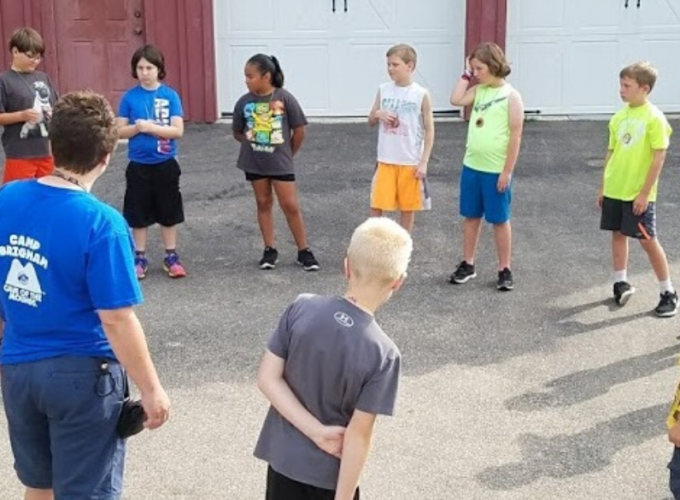 Kids standing in a circle chatting