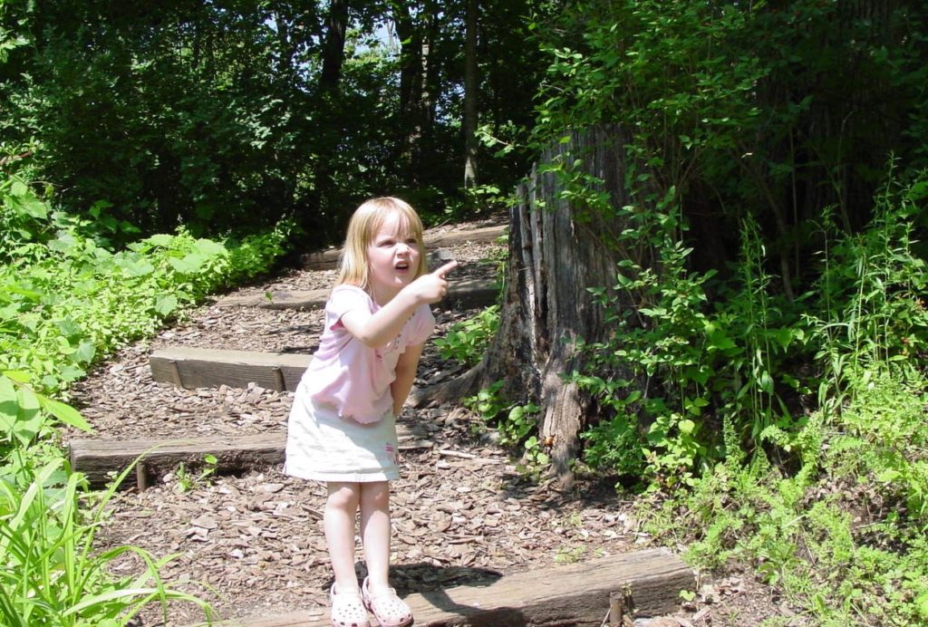 Photo of a girl exploring our Karst Trail