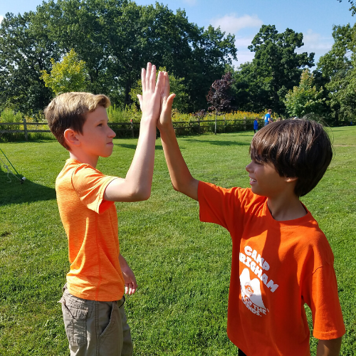 Photo of kids high fiving