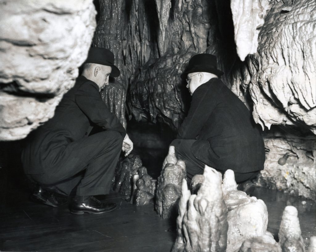 Photo of our two developers squatting in the cave. It seems like they are trying to figure something out.