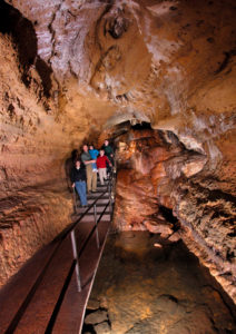 Photo of Painted Waterfall Area of the cave with People at one of wisconsin's must see places
