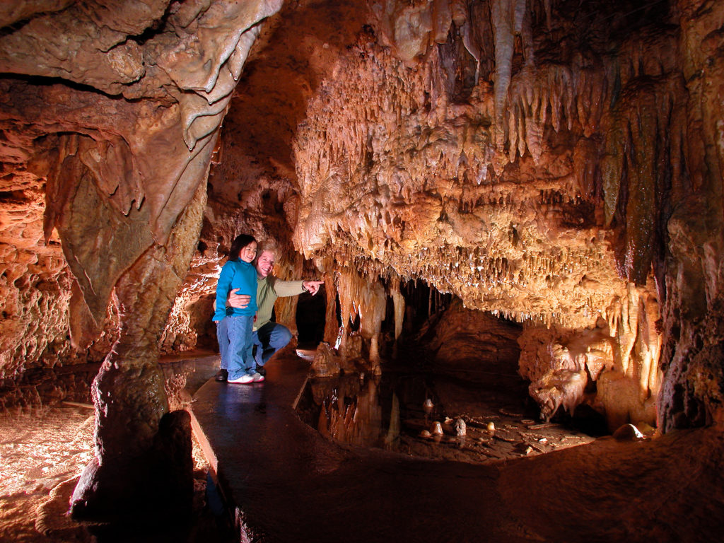 Photo of People exploring the cave.