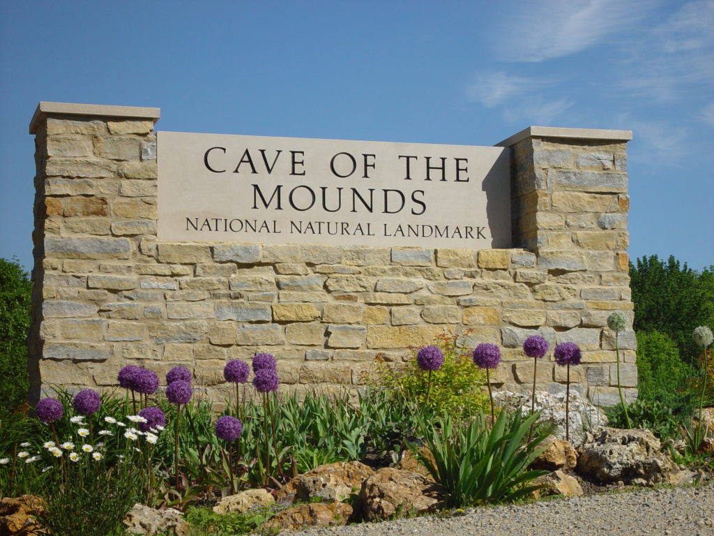 Photo of our Entrance Sign with purple flowers at this must-see place in Wisconsin​