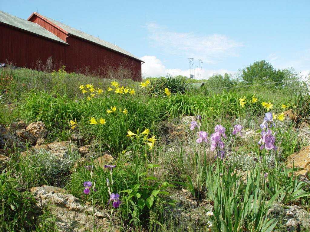 Photo of Grounds and Gardens with Flowers with a Barn