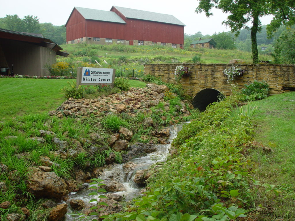 Landscape Photo of a barn and a flowing stream in the Driftless Area. That stream table is an example of the importance of water.