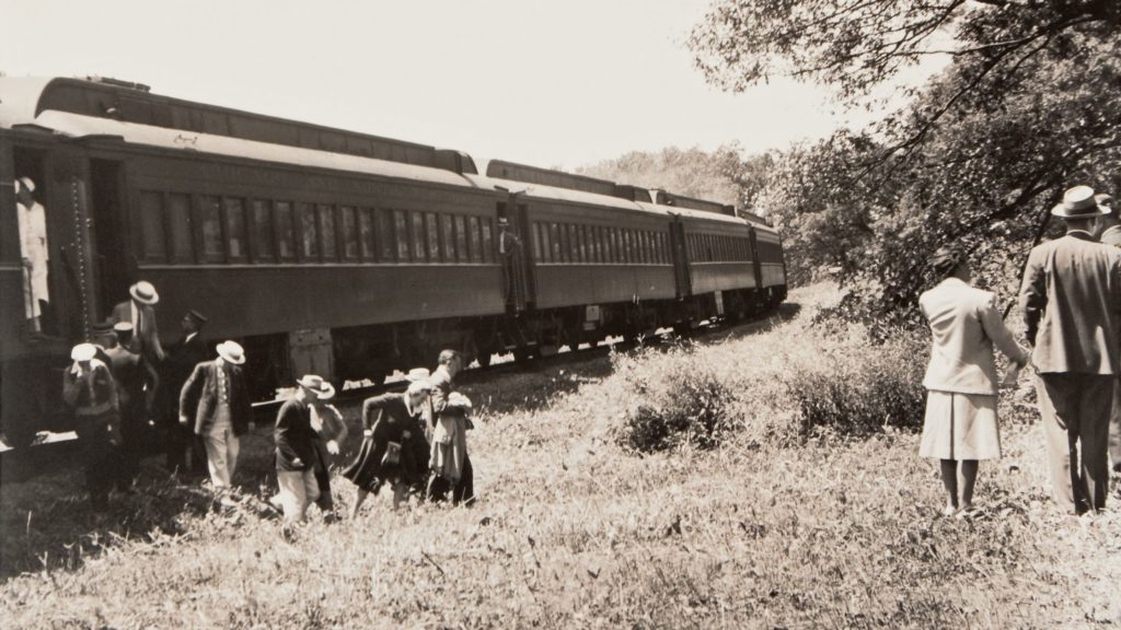 People exiting the train on Military Ridge Trail to Cave of the Mounds