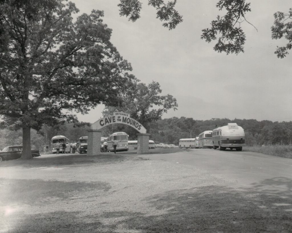 Large coach busses by Cave Entrance Sign circa 1950s