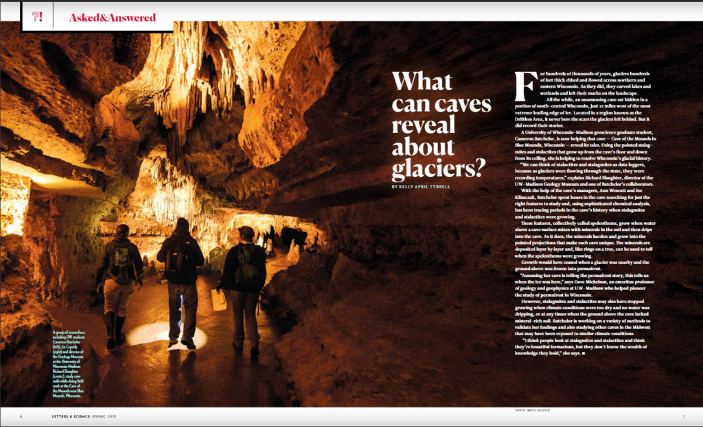 An article title page depicting several people walking through the cave.