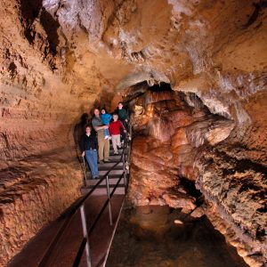 Photo of Painted Waterfall Area of the cave with People at one of wisconsin's must see places