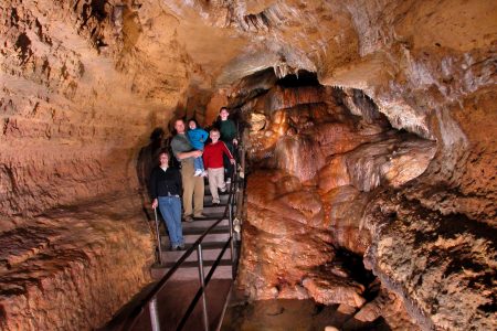 Photo of Painted Waterfall Area of the cave with People at one of wisconsin's must see places