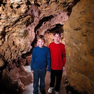 Photo of Kids in the Meanders of the cave Walking at this must-see place in Wisconsin​