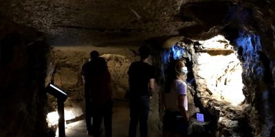 People looking at different areas of the cave