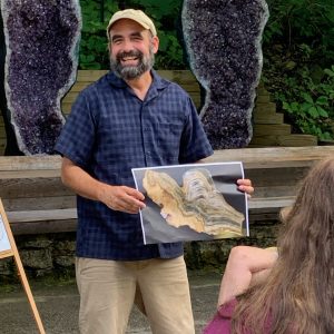 Photo of Dr. Richard Slaughter talking at a lecture at Cave of the Mounds.