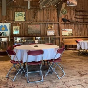 Tables and chairs for a dinner in barn