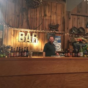 Happy guy at bar in barn
